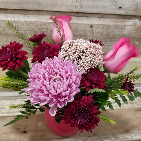 Flower Arrangement/Bouquet - Pink Roses, Mums, and Assorted Greens in a fuchsia Ceramic Container